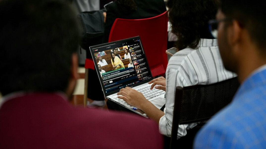 group of students coding together