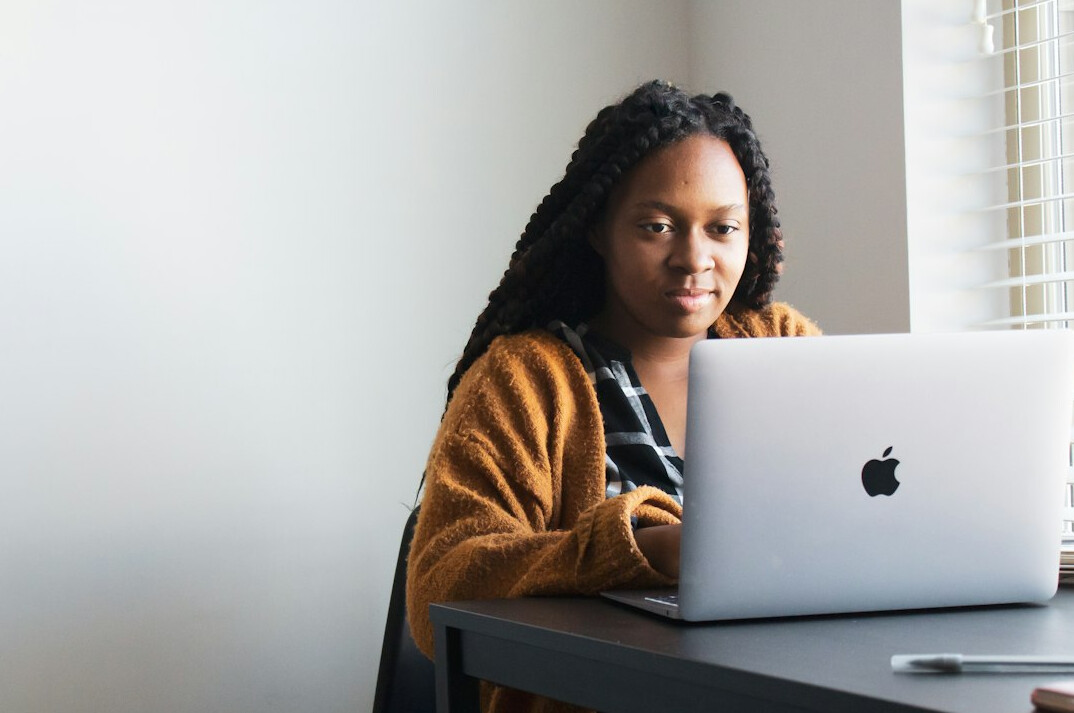 student studying with laptop