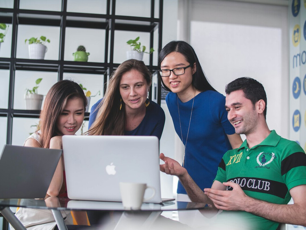diverse group discussing code